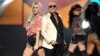 Ke$ha, left, and Pitbull perform at the American Music Awards at the Nokia Theatre L.A. Live on Nov. 24, 2013, in Los Angeles. 