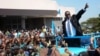 FILE - Newly elected Malawian president Peter Mutharika greets supporters after he was sworn in at the High Court in Blantyre, Malawi, May 31, 2014.