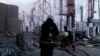 Firefighters extinguish a blaze at an electricity facility after a Russian attack in Kharkiv, Ukraine, on March 22, 2024.