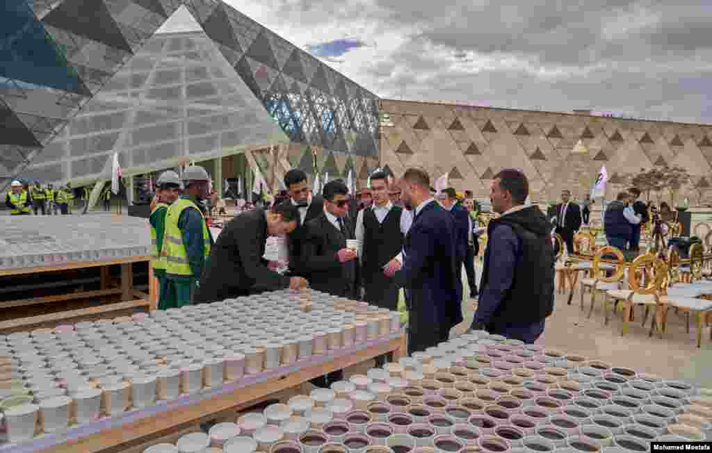 For "Guinness" to record the event, the coffee cups have to be distributed to people to drink. (H. Elrasam/VOA)