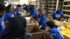 Volunteers at Islamic Relief USA in Alexandria, Virginia, pack boxes with food for families in the U.S. and more than 40 countries around the world. 