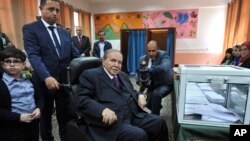 Algerian President Abdelaziz Bouteflika looks on after voting in Algiers, May 4, 2017.