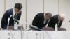 Tokyo-based eel restaurant chain Nihonbashi Isesada director Soichiro Tomita, center, and Keikyu Department Store President Shinji Kaneko, left, apologize at a press conference in Yokohama on July 29, 2024.