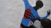 A man living with HIV paints his body map in Kisumu, Kenya, July 6, 2011. (X. Verhoest/VOA)