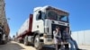 Trucks carrying humanitarian aid line up on the Egyptian side of the Rafah border crossing with the Gaza Strip on March 2, 2025, after Israel suspended the entry of supplies into the Palestinian enclave.