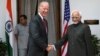 U.S. Vice President Joe Biden (L) shakes hands with Indian Vice President Hamid Ansari as they pose for the media before a meeting in New Delhi, India, July 23, 2013.