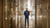 FILE - Daniel Hsu, a U.S. citizen, poses for a portrait near the apartment he’s been staying in in Shanghai, China, April 13, 2020.