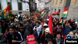People shout slogans during a protest against Bolivia's President Evo Morales in La Paz, Bolivia, Nov. 9, 2019.