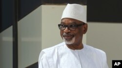 FILE - Mali President Ibrahim Boubacar Keita poses for a group picture during the G5 Sahel summit in Nouakchott, June 30, 2020.