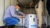 Personnel check the first shipment of the Pfizer's vaccine against the coronavirus disease (COVID-19) at Baghdad International Airport, in Baghdad, Iraq, Apr. 11, 2021. 