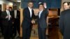President Barack Obama and Japanese Prime Minister Shinzo Abe shake hands before having dinner at Sukiyabashi Jiro sushi restaurant in Tokyo, April 23, 2014. 
