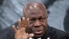 FILE - Gilbert Houngbo, director-general of the International Labor Organization, talks to the media in Berlin, Nov. 29, 2022. Houngbo said of an ILO study on March 19, 2024: "Forced labor perpetuates cycles of poverty and exploitation and strikes at the heart of human dignity."