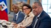 FILE - Haiti's Prime Minister Garry Conille, right, sits next to Foreign Minister Dominique Dupuy during a meeting with Secretary of State Antony Blinken, July 2, 2024, at the State Department in Washington.